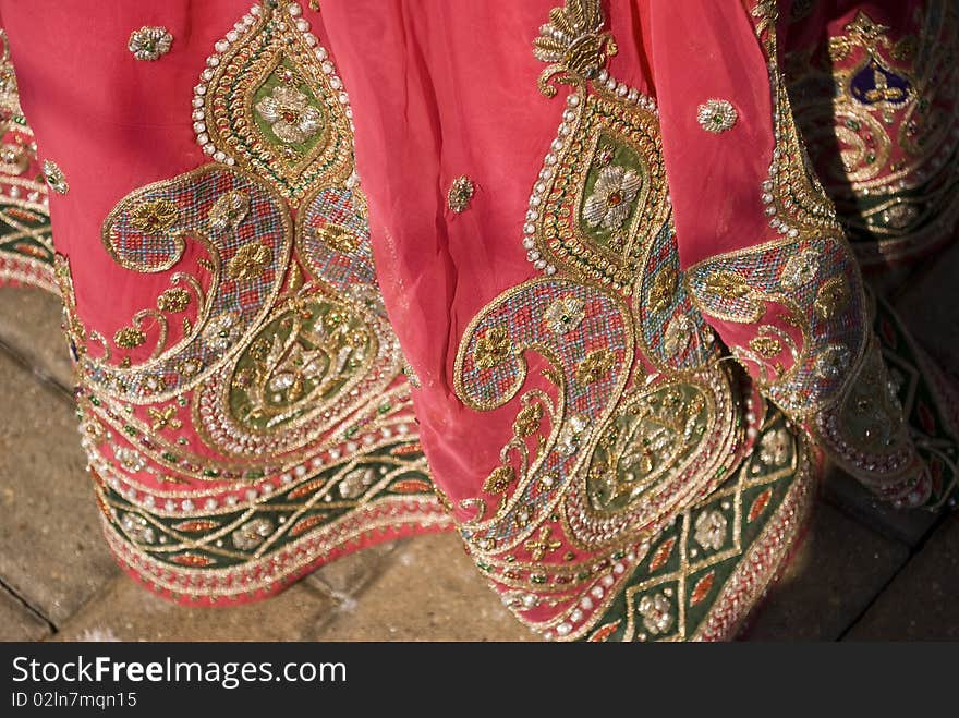 Closeup shot of an indian woman's dress. texture and details. Closeup shot of an indian woman's dress. texture and details