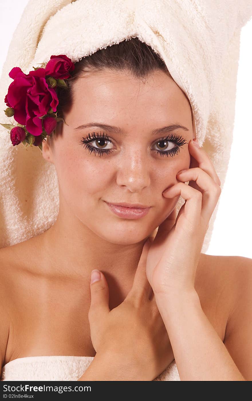 Beautiful young woman with towels and roses. Beautiful young woman with towels and roses.