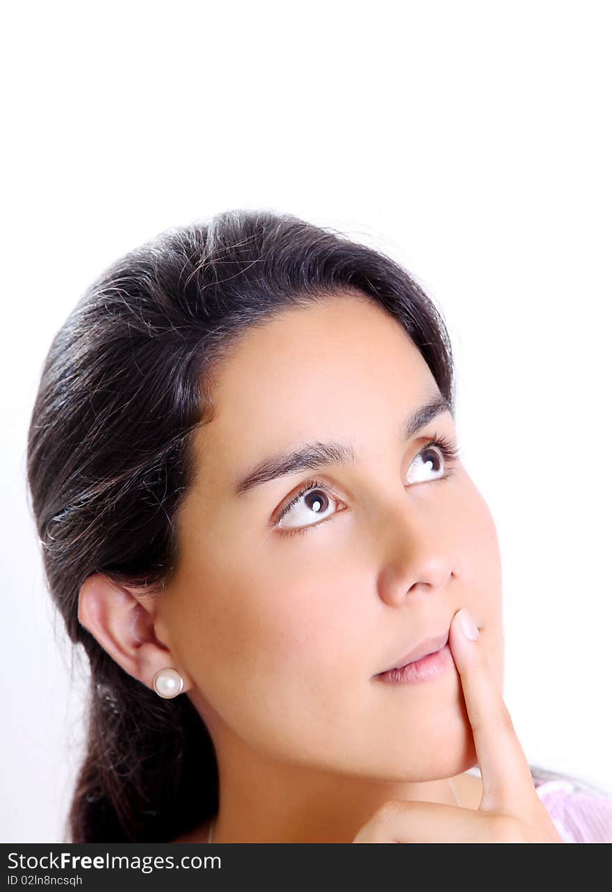 Girl thinking and looking up, over white background. Isolated image