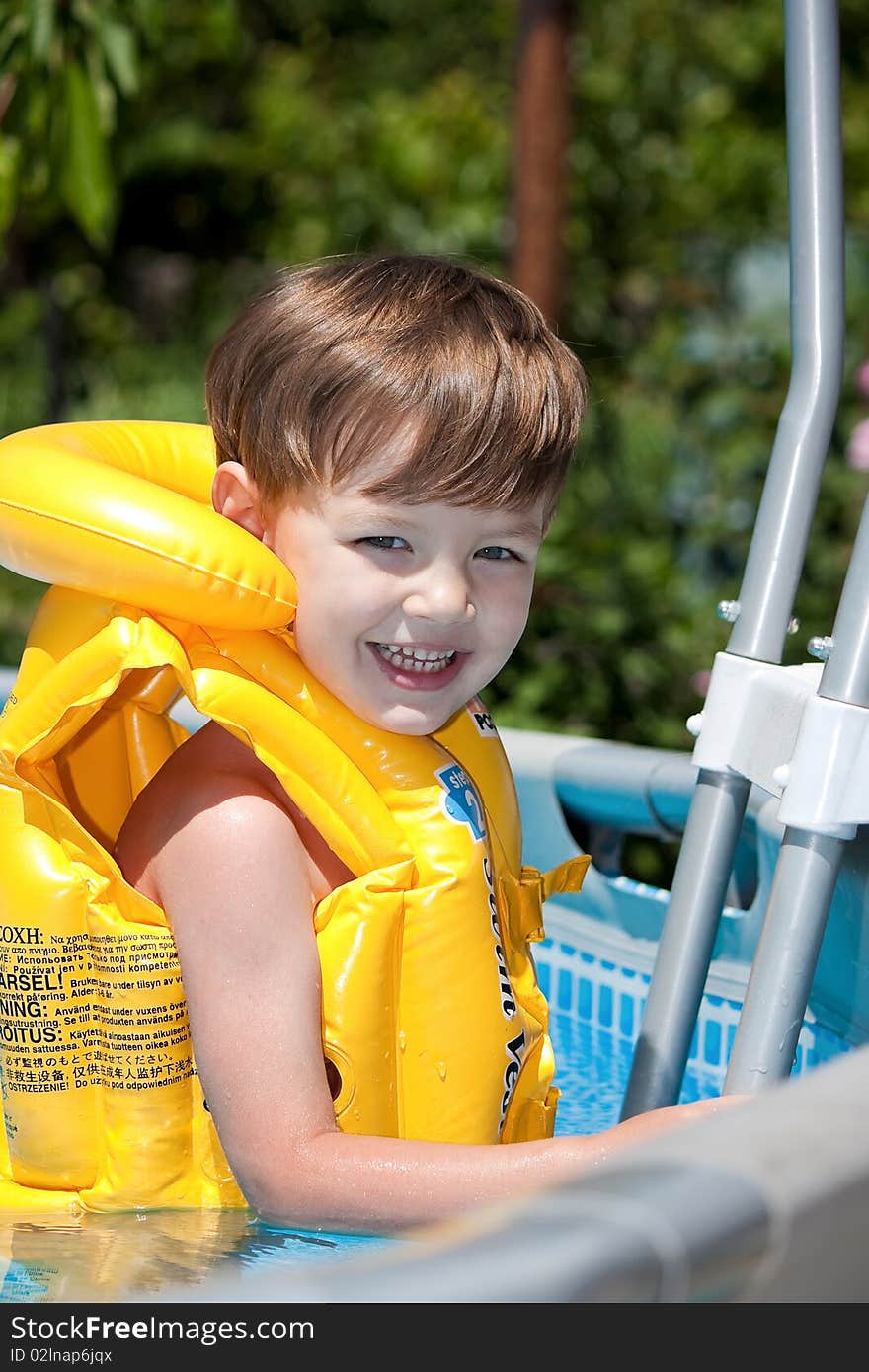 Happy boy in the pool