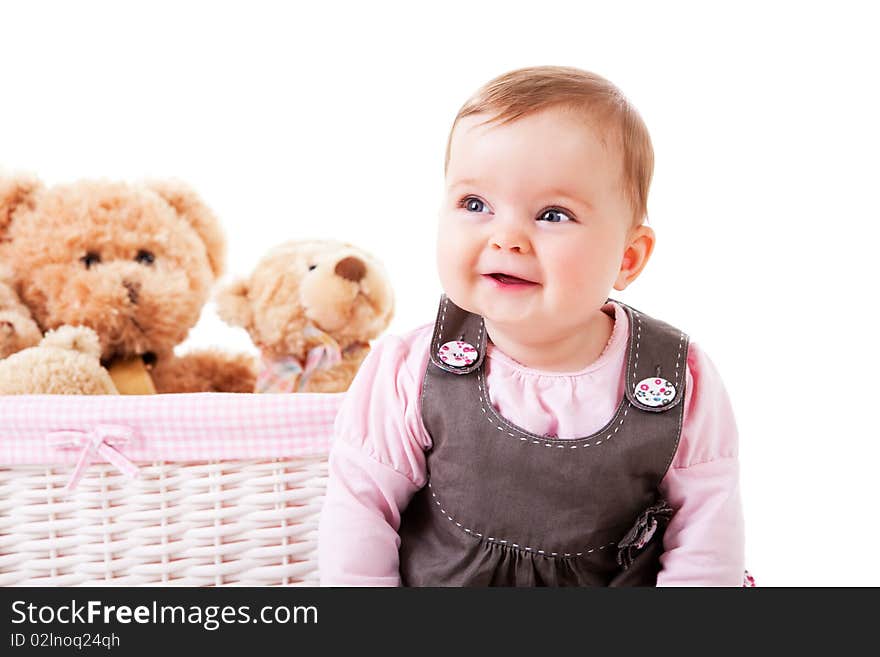 Toddler Sitting Next to Teddy Bears