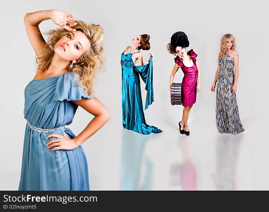 Young Women Modeling Elegant Fashions