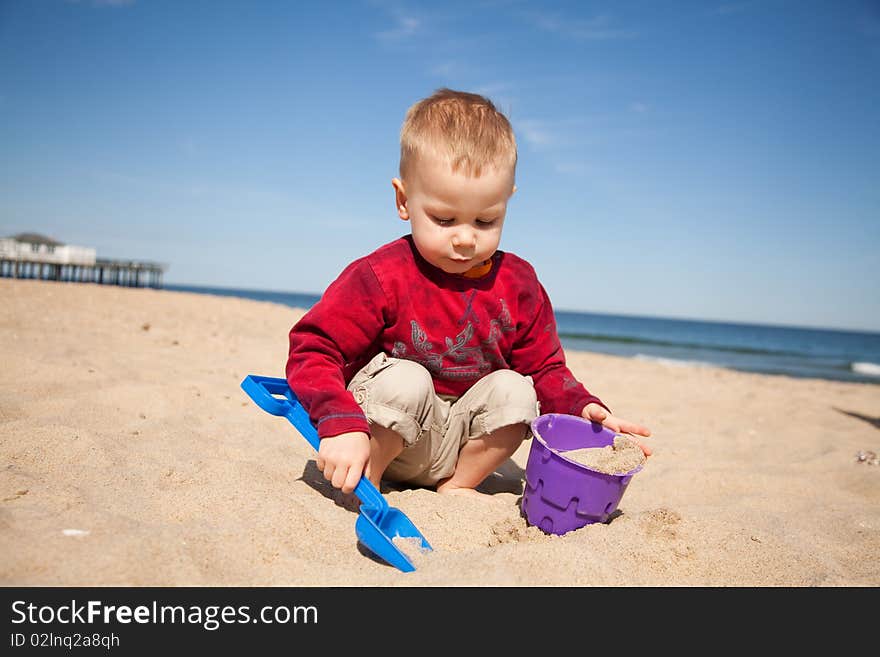 Small boy playing at the beach