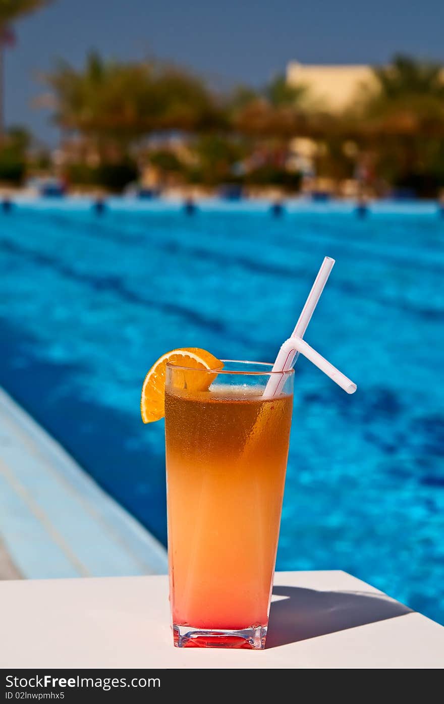 Tasty cocktail with lemon at the african resort, swimming pool. Tasty cocktail with lemon at the african resort, swimming pool.