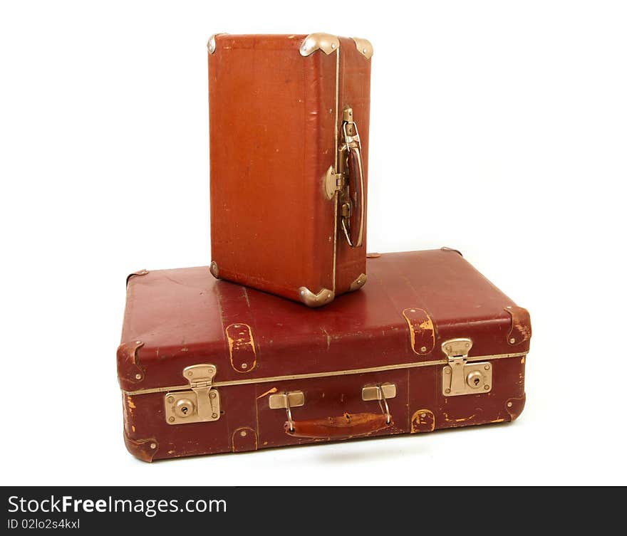 Two old suitcases for travel on white background