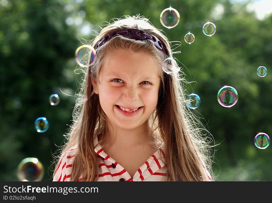 An image of a nice little girl with bubbles. An image of a nice little girl with bubbles