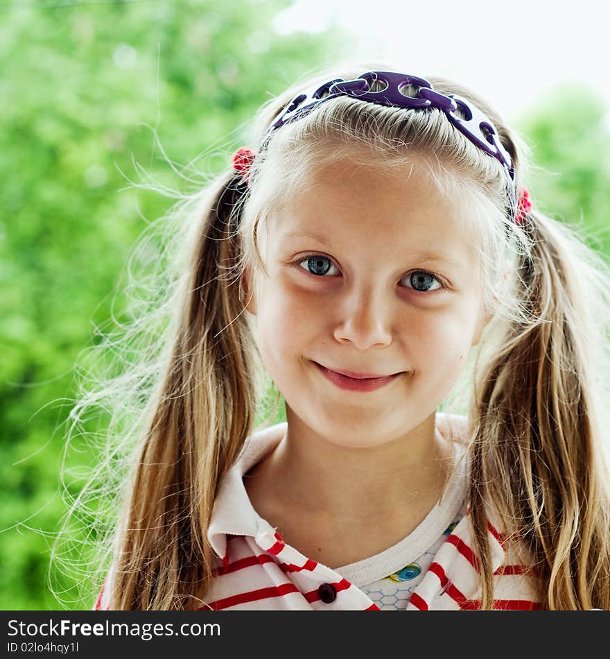 An image of a nice little girl outdoors. An image of a nice little girl outdoors