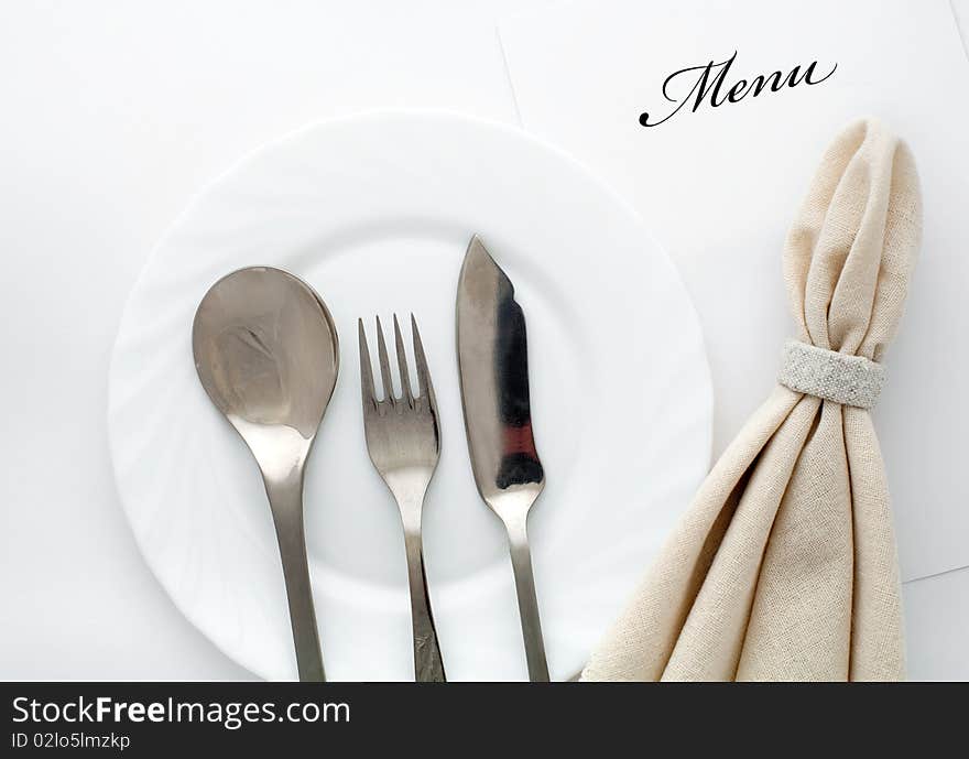 An image of fork, spoon and knife with napkin. An image of fork, spoon and knife with napkin