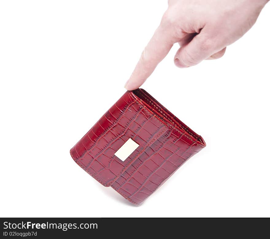 A hand holding a red purse over a white background