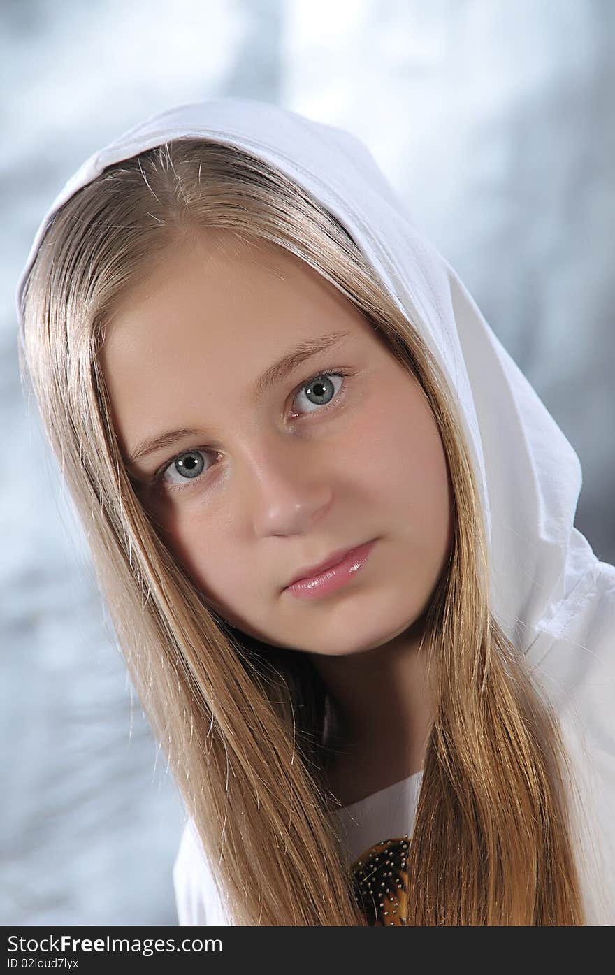 Portrait of long-haired girl in a white hood