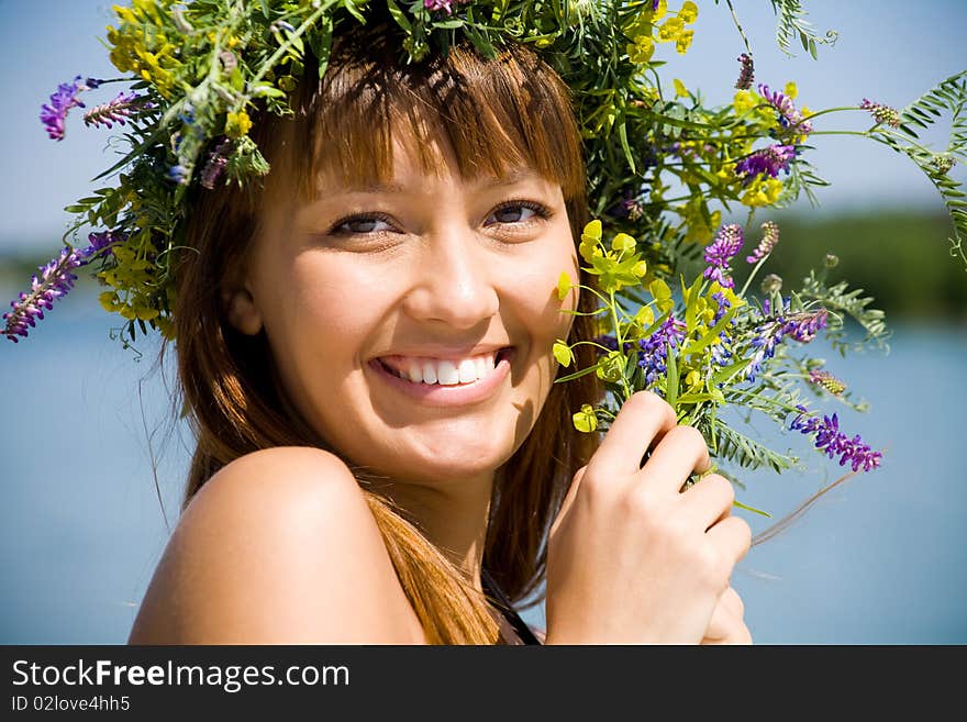 Pretty girl with floral wreath