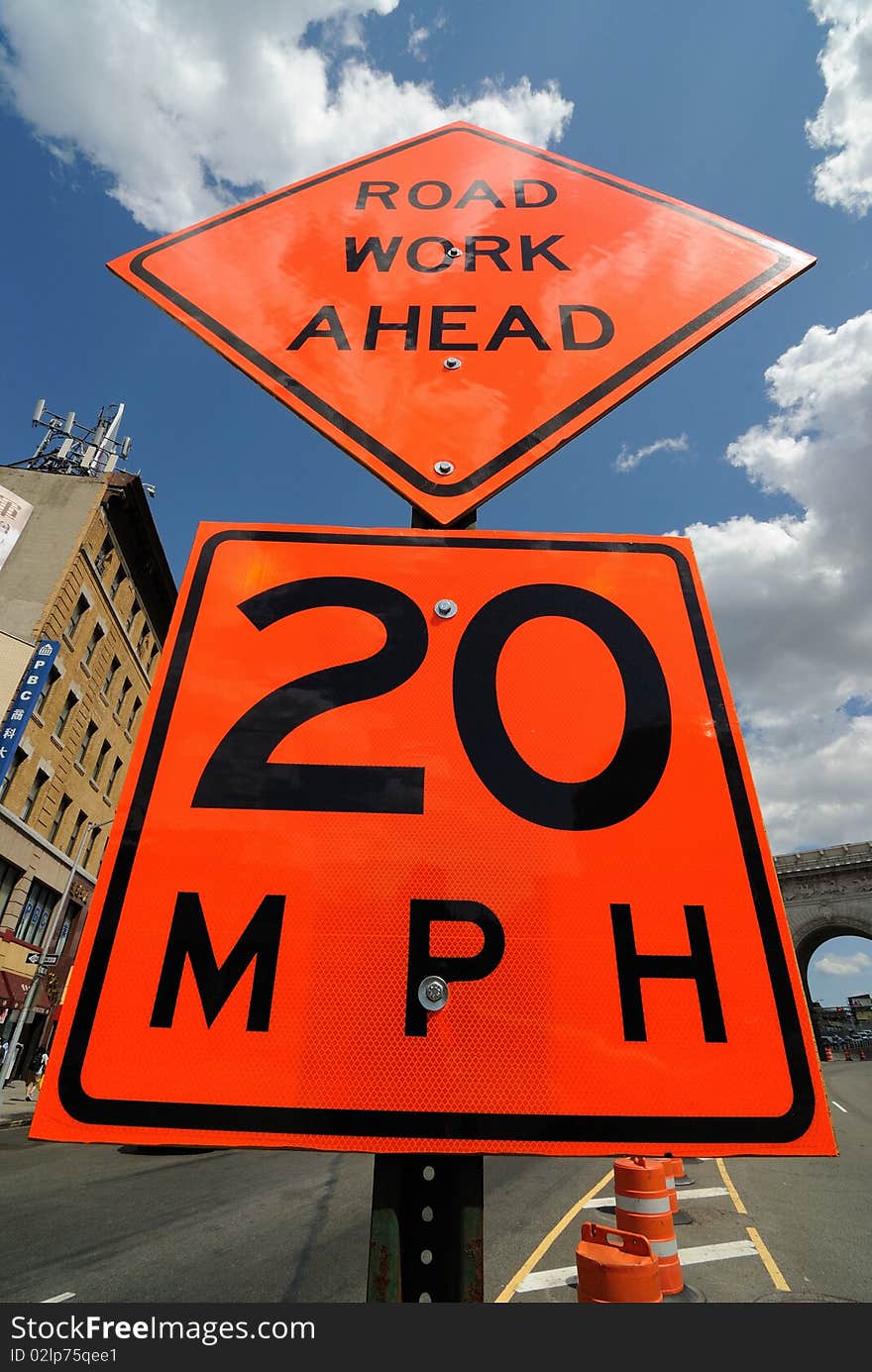 Sign indicating road work ahead and 20 mph speed limit. Sign indicating road work ahead and 20 mph speed limit.