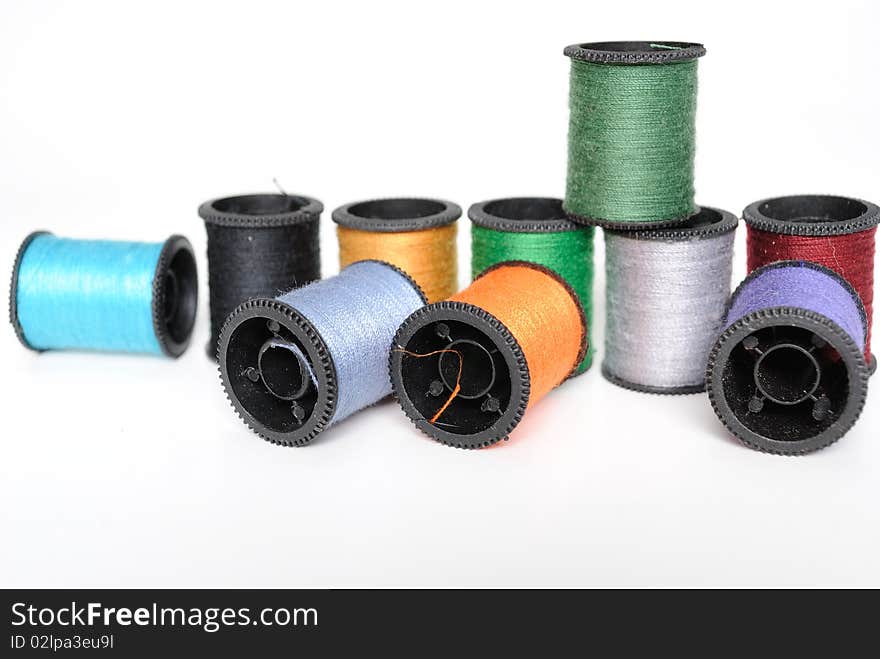 Colorful spools of thread in pile. Colorful spools of thread in pile.