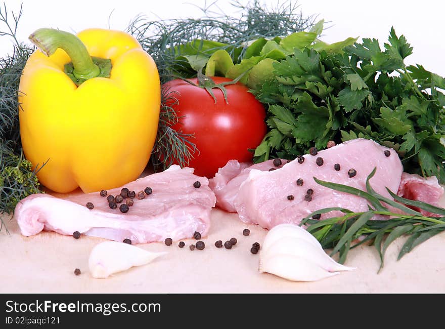 Fresh vegetables and pork isolated on a white background. Fresh vegetables and pork isolated on a white background