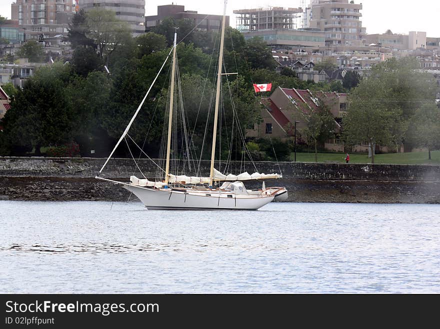 Sailboat along the Fraser River BC. Sailboat along the Fraser River BC