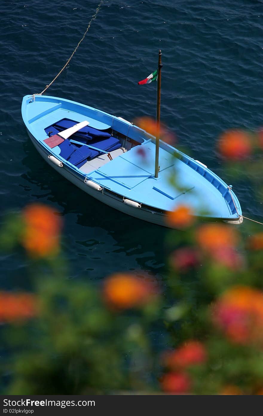 Wood boat on the blue sea