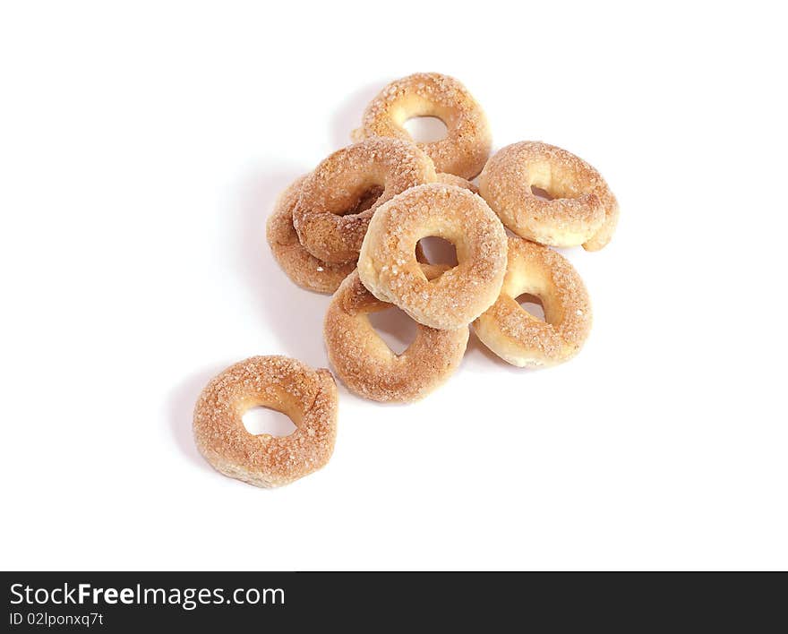 Round cookies strewed by sugar isolated on white