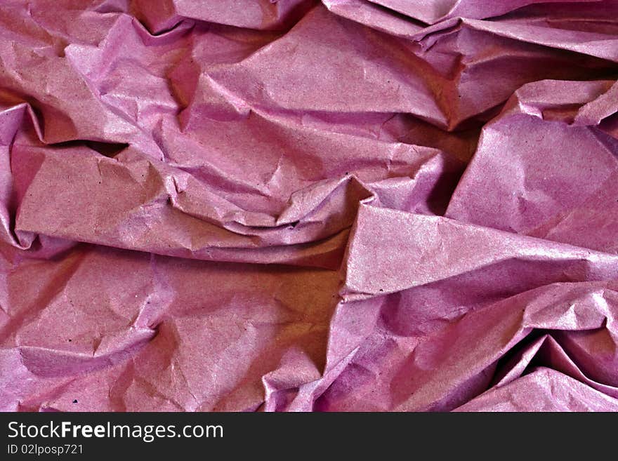 A closeup of red scrunched up paper. A closeup of red scrunched up paper