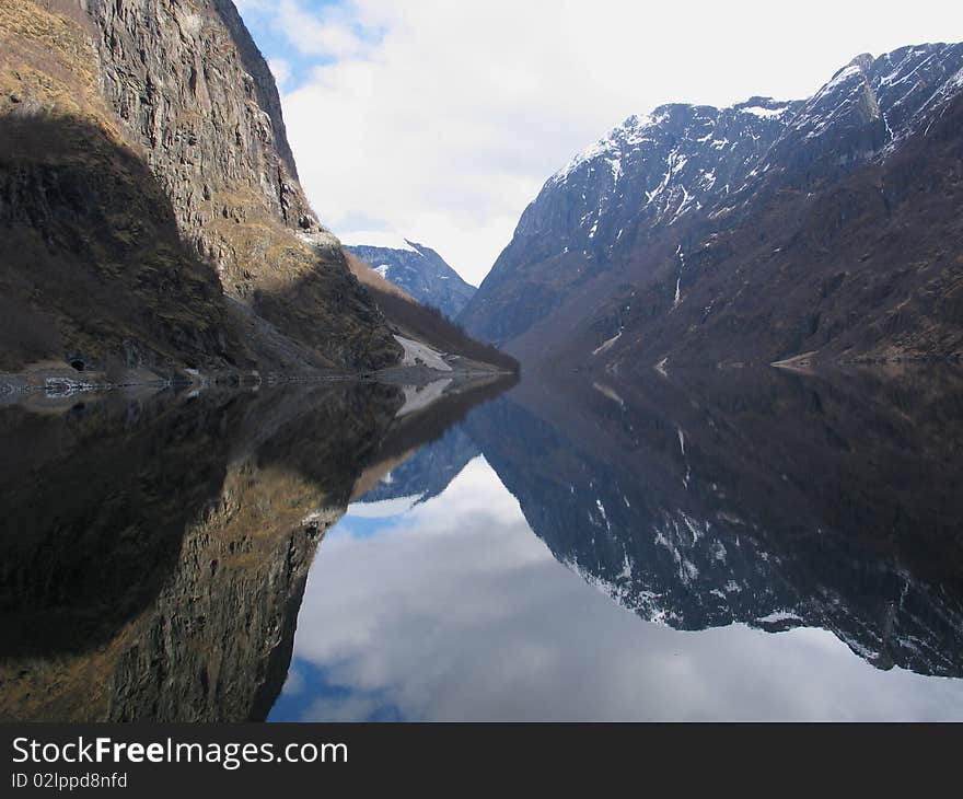 Fjord in Norway with a mountain reflexion in water