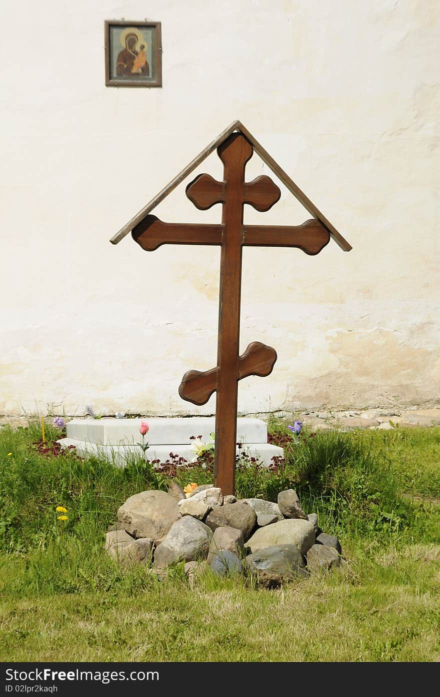 Cross at a temple wall, a tomb - the External Cathedral, Russia