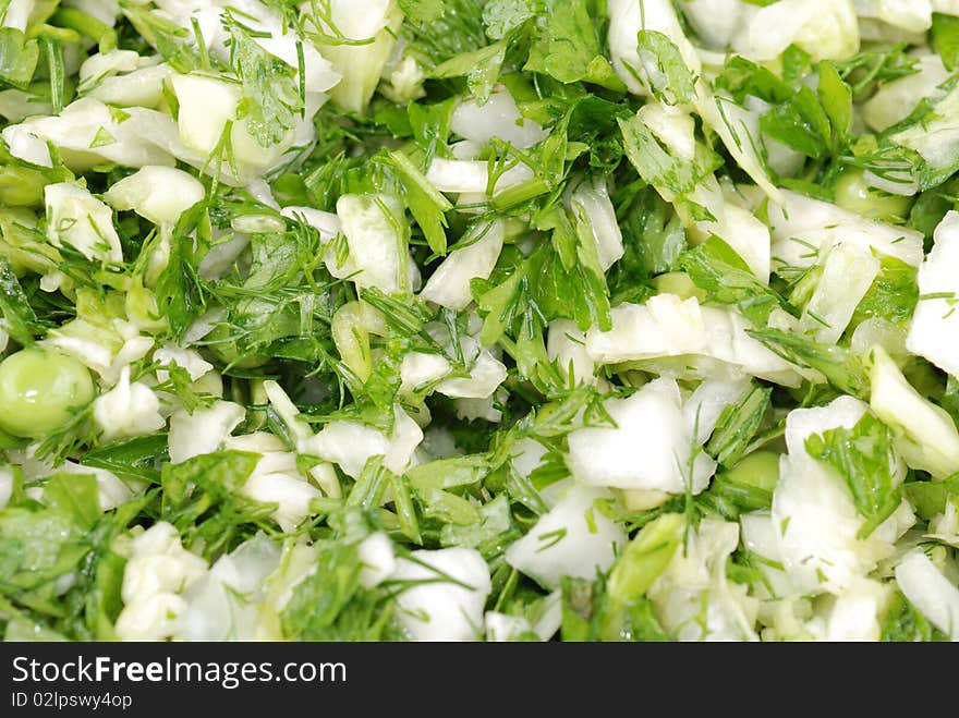 Fresh salad from vegetables and greens on a plate