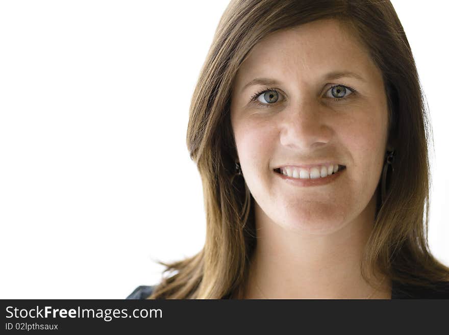 Closeup Portrait of a Smiling Young Woman Looking Directly To The Camera