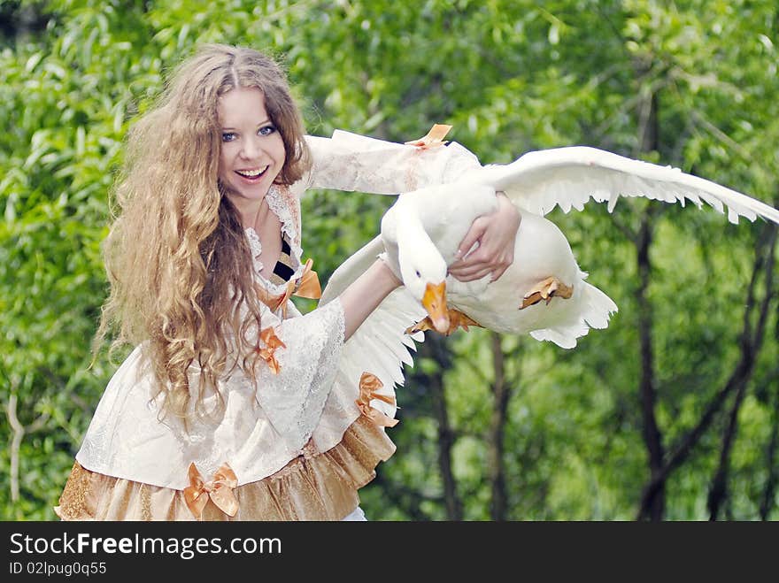 Girl has caught a goose