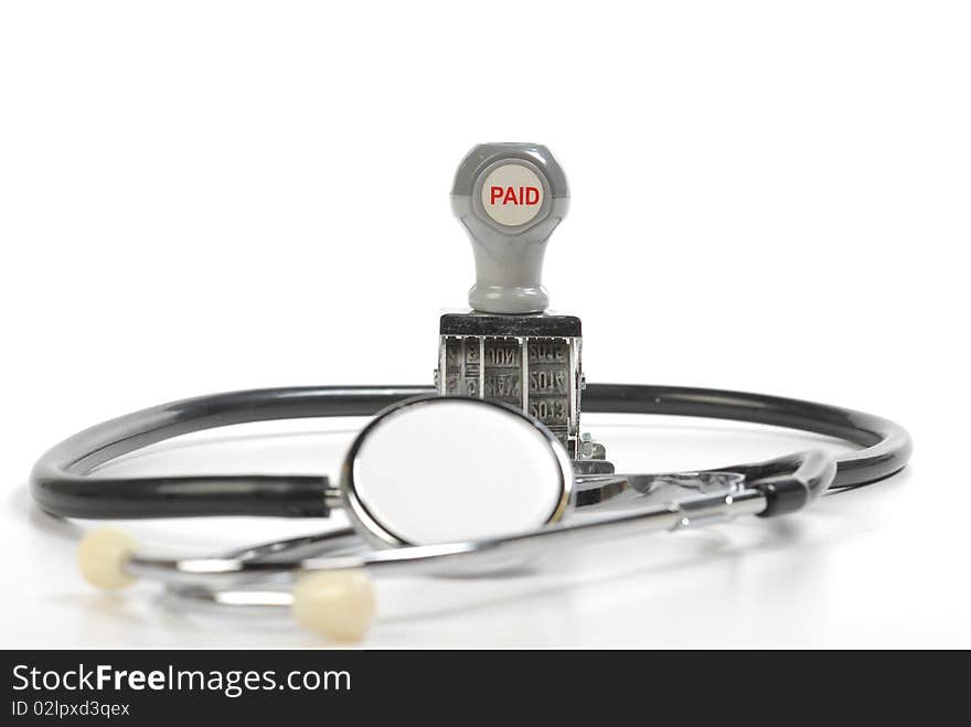 Stethoscope and paid stamp isolated on white. Stethoscope and paid stamp isolated on white