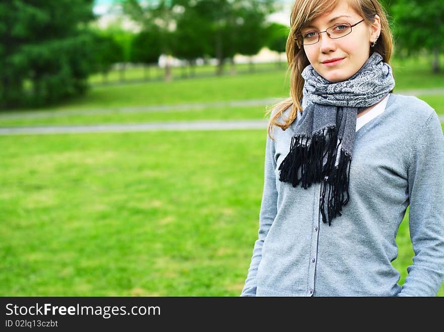 The young girl in glasses. City park