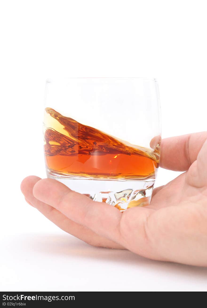 Glass Of Brandy Holding By Hand