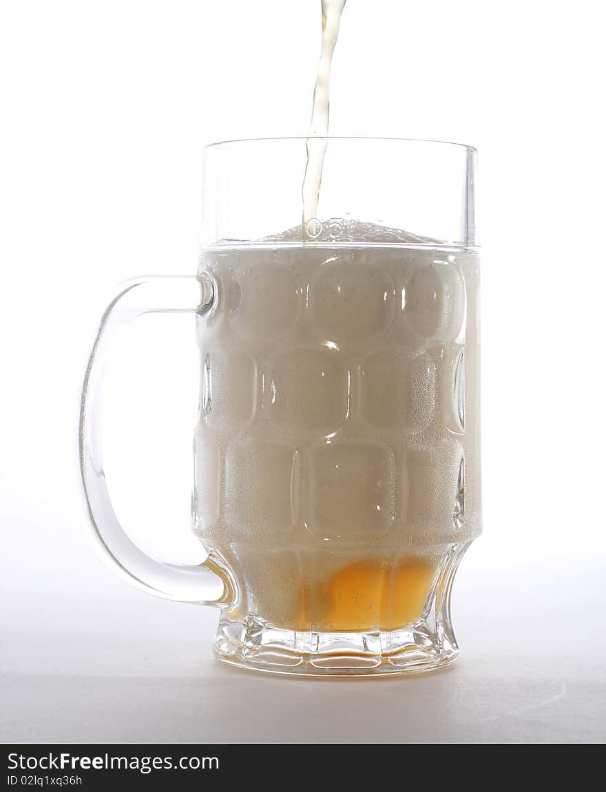 Mug with beer isolated on white