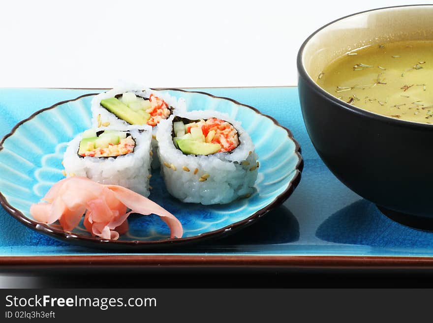 Fresh Sushi with ginger root and soup on an oriental table setting. Fresh Sushi with ginger root and soup on an oriental table setting.