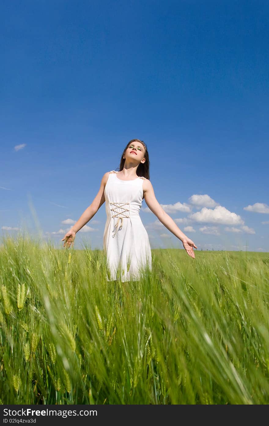 Young happy girl in wheat field. Young happy girl in wheat field