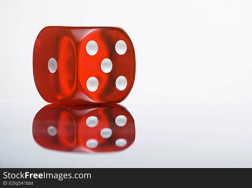 Red semi-translucent dice with reflection. Red semi-translucent dice with reflection