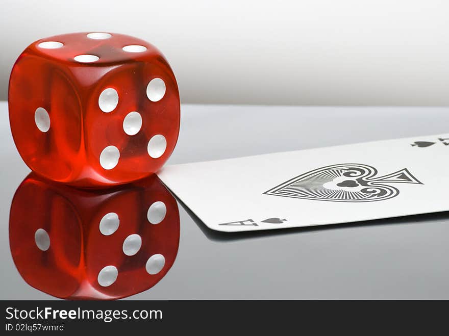 Red dice with reflection and playing card. Red dice with reflection and playing card