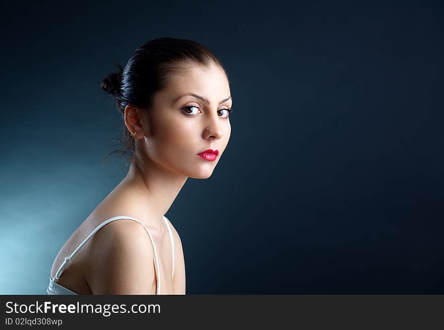 The portrait of a beautiful lady in a white dress