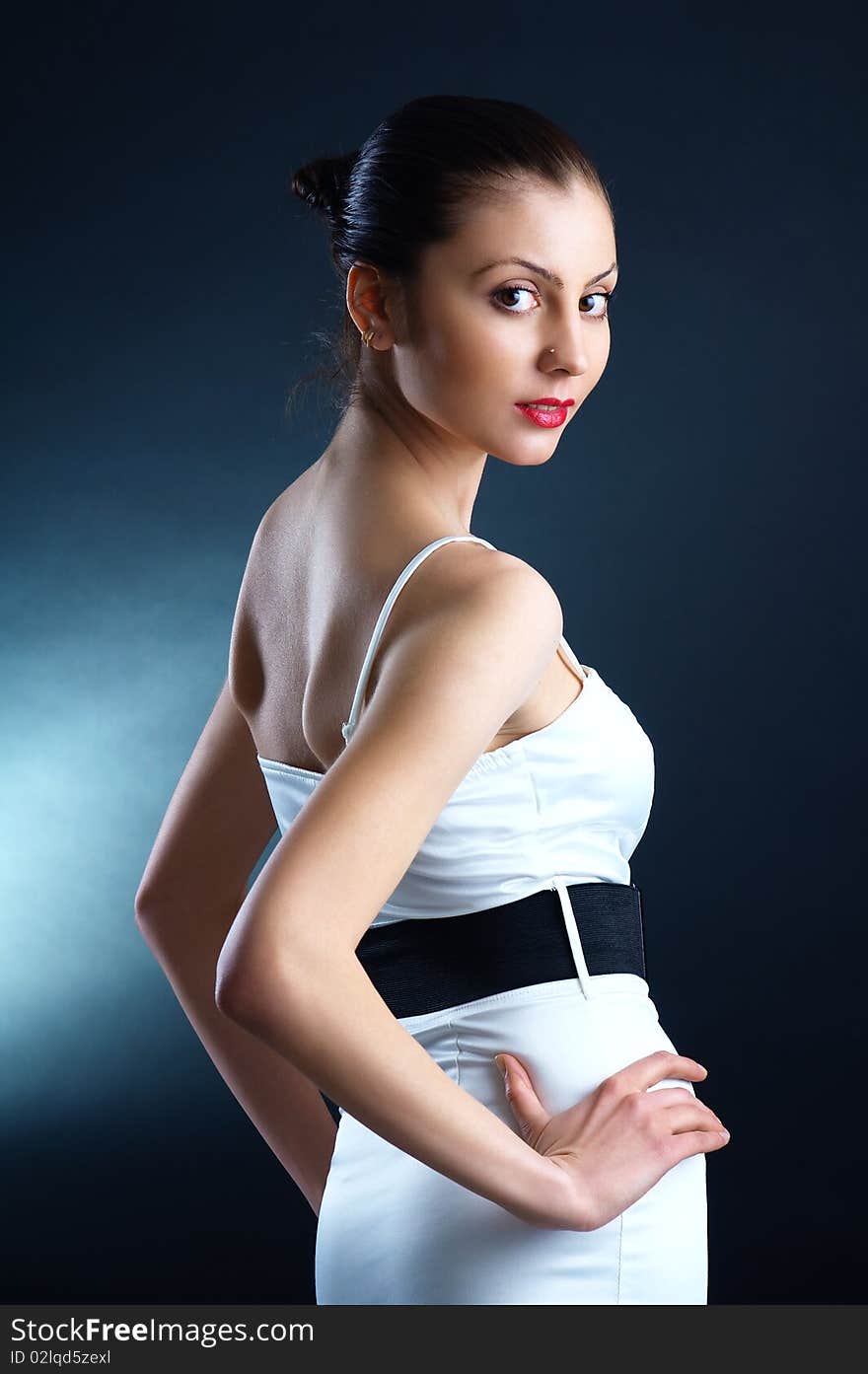 The portrait of a beautiful lady in a white dress