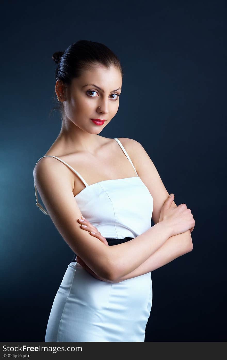 The portrait of a beautiful lady in a white dress