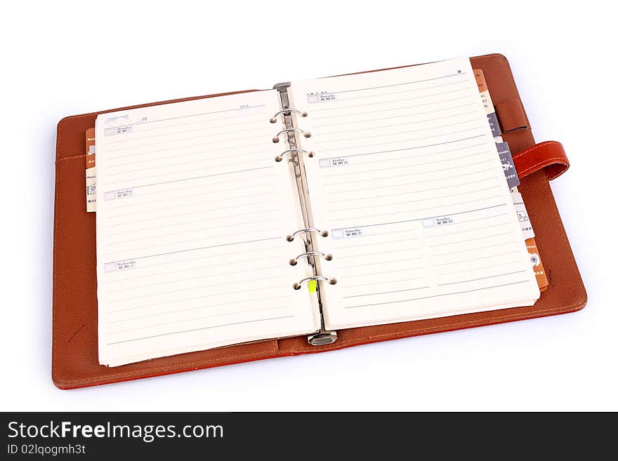 Orange leather notebook isolated on white