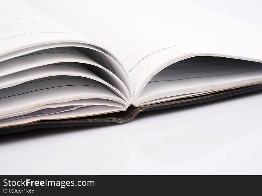 Orange leather notebook isolated on white