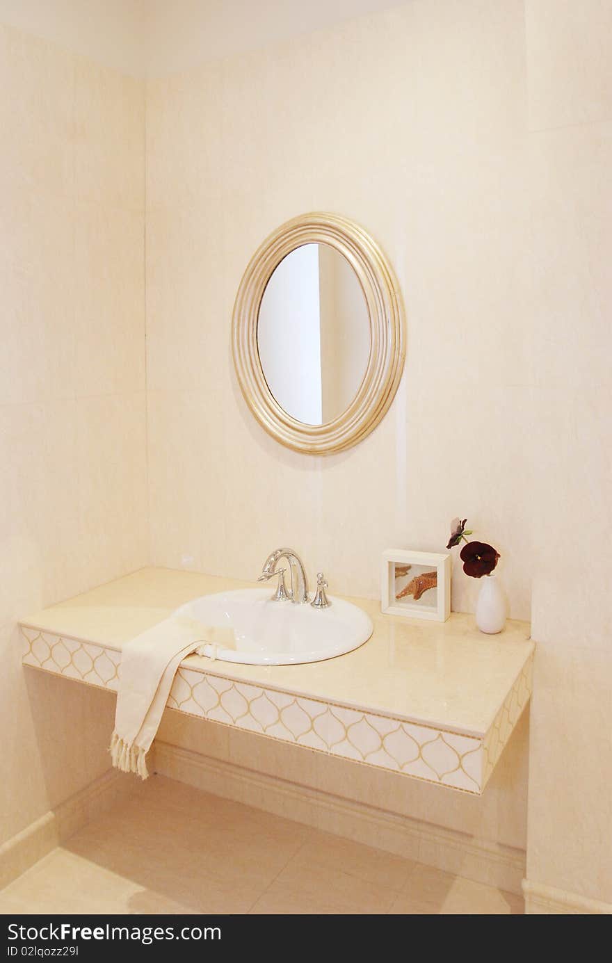 It is interior of apartment, it is a basin in the bathroom