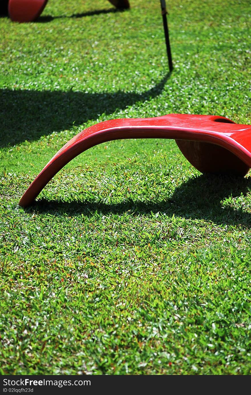 Red chair on green Grass.