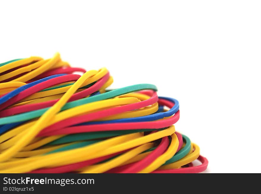 A pile of rubber bands on a white background