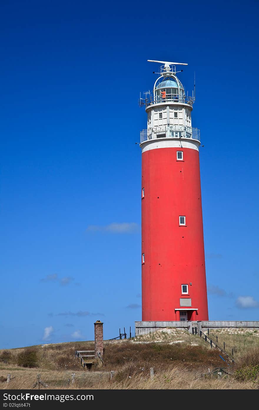 Lighthouse In The Dunes At The Beach