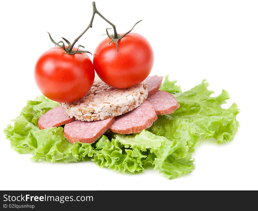 Sandwich with sausage, tomatoes and salad