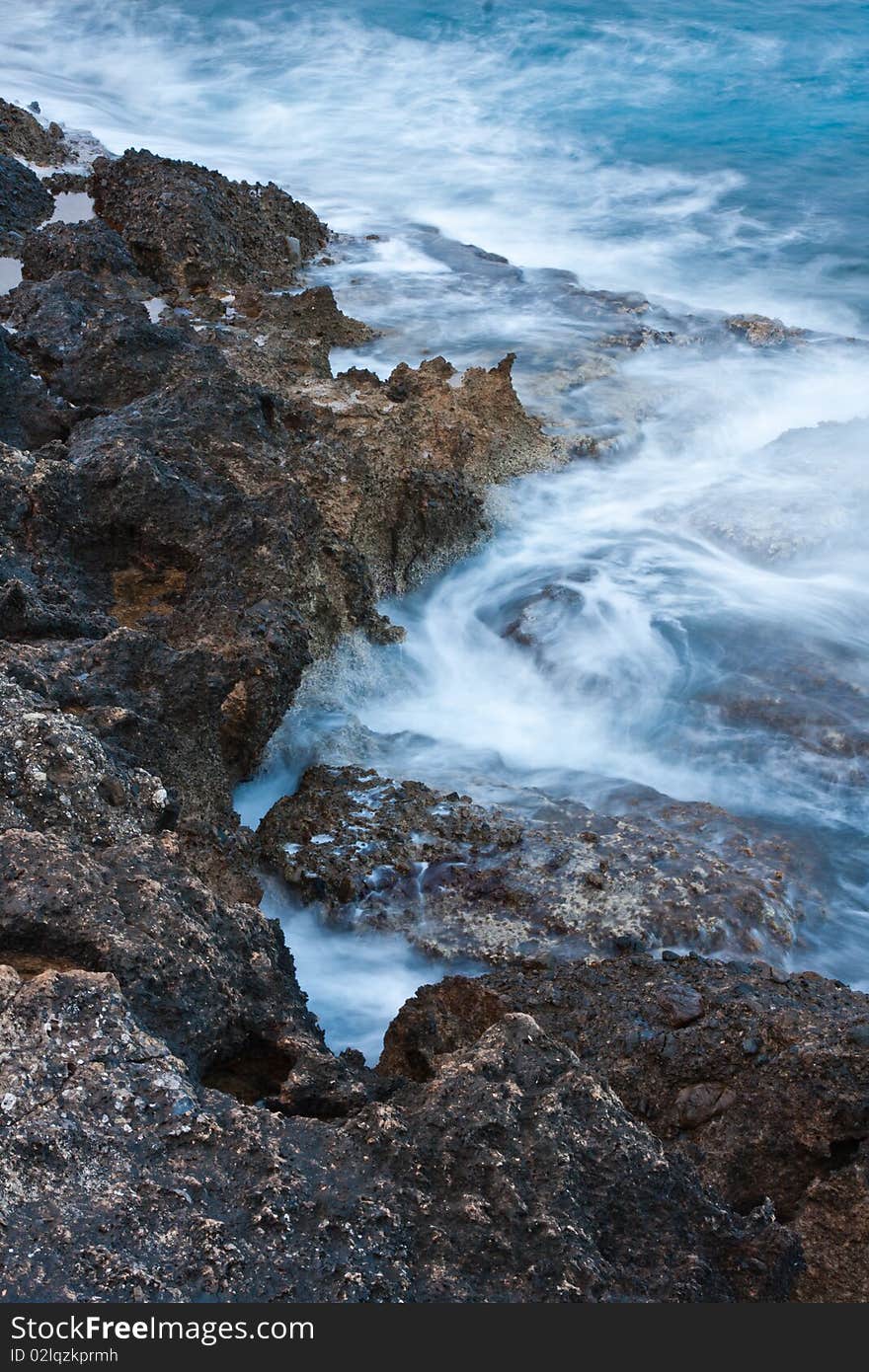 Waves crushing onto rocks