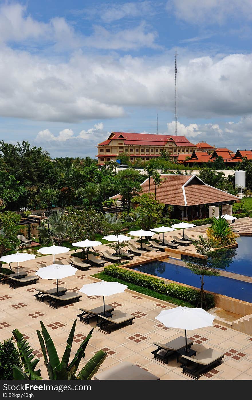 This is swimming pool and garden of a Siem Reap Hotel.