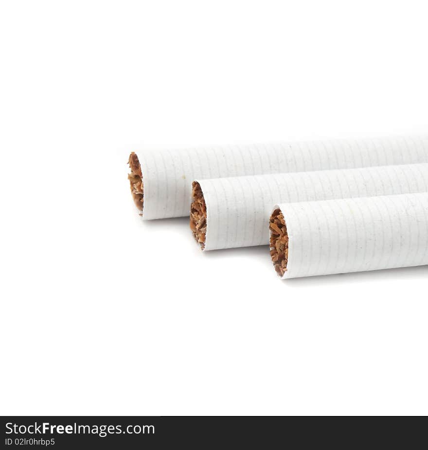 Unlit cigarette tips on a white background with copy space. Unlit cigarette tips on a white background with copy space