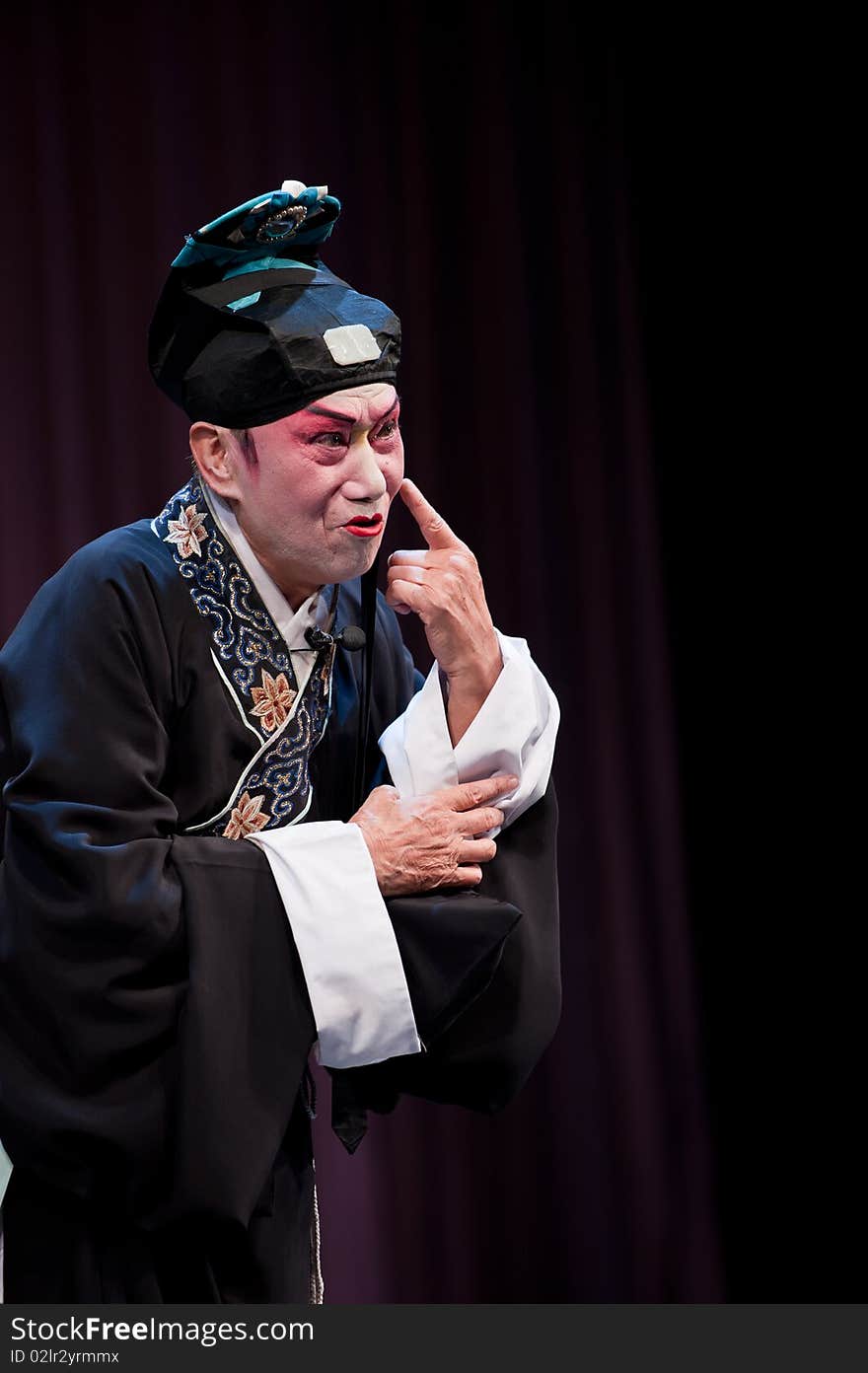 China opera Scholar with black hat，Pointing to his nose。. China opera Scholar with black hat，Pointing to his nose。