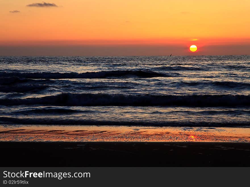 Beautiful sunset with the sun above the ocean. Beautiful sunset with the sun above the ocean